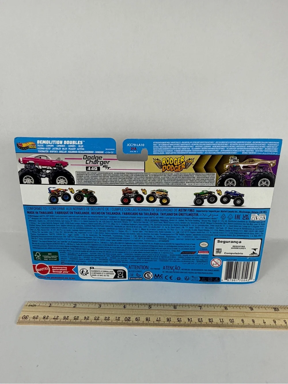 Hot Wheels monster trucks, Pink Dodge Charger, and Purple Roger Dodger. New